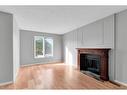 231 Sandstone Road Nw, Calgary, AB  - Indoor Photo Showing Living Room With Fireplace 