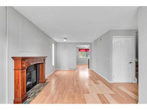 231 Sandstone Road Nw, Calgary, AB - Indoor With Fireplace