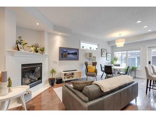 2-528 34 Street Nw, Calgary, AB - Indoor Photo Showing Living Room With Fireplace