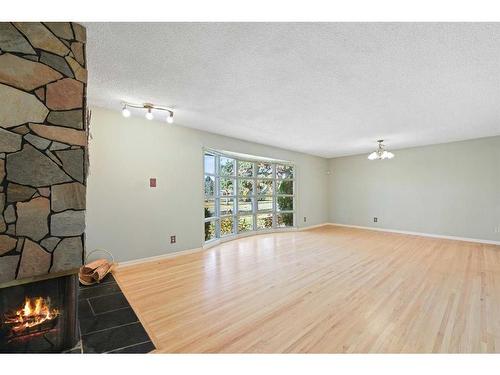 796 Acadia Drive Se, Calgary, AB - Indoor Photo Showing Living Room With Fireplace