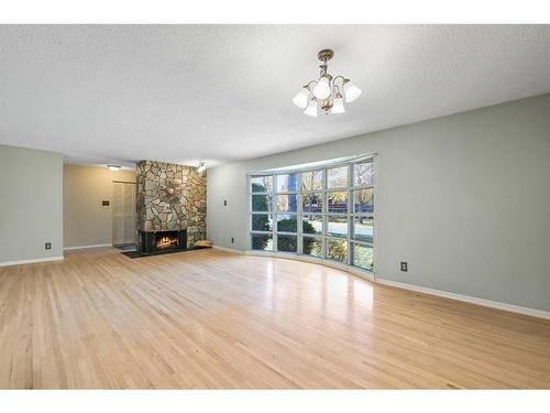 796 Acadia Drive Se, Calgary, AB - Indoor Photo Showing Other Room With Fireplace