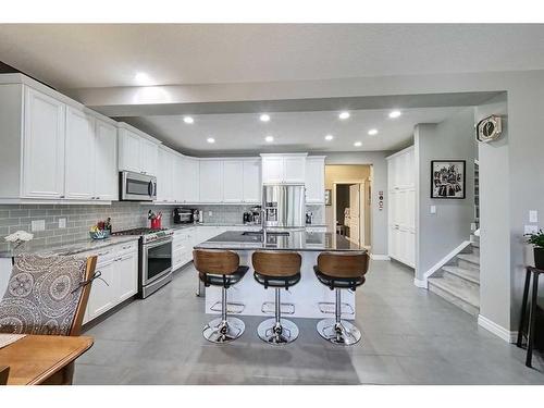 14 Riviera Point, Cochrane, AB - Indoor Photo Showing Kitchen With Double Sink