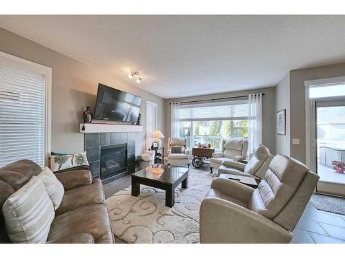 14 Riviera Point, Cochrane, AB - Indoor Photo Showing Living Room With Fireplace