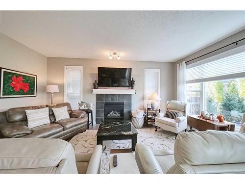 14 Riviera Point, Cochrane, AB - Indoor Photo Showing Living Room With Fireplace