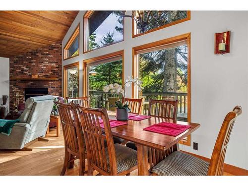 20 Pinewood, Canmore, AB - Indoor Photo Showing Dining Room With Fireplace