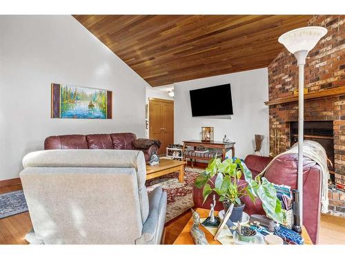 20 Pinewood, Canmore, AB - Indoor Photo Showing Living Room With Fireplace