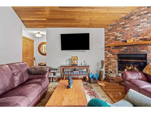 20 Pinewood, Canmore, AB - Indoor Photo Showing Living Room With Fireplace