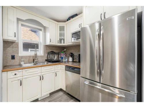 216 Taradale Drive Ne, Calgary, AB - Indoor Photo Showing Kitchen With Double Sink