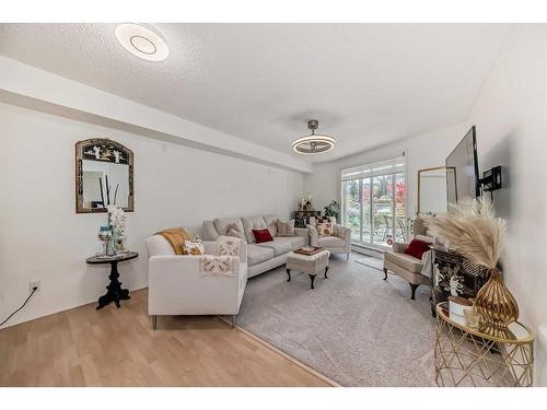 101-380 Marina Drive, Chestermere, AB - Indoor Photo Showing Living Room