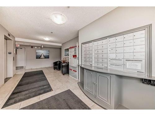 101-380 Marina Drive, Chestermere, AB - Indoor Photo Showing Other Room