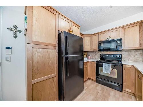 101-380 Marina Drive, Chestermere, AB - Indoor Photo Showing Kitchen