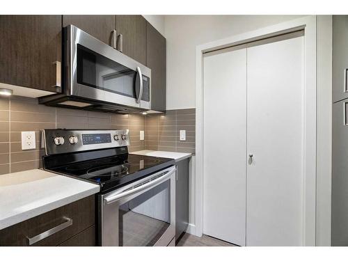 212-28 Auburn Bay Link Se, Calgary, AB - Indoor Photo Showing Kitchen With Stainless Steel Kitchen