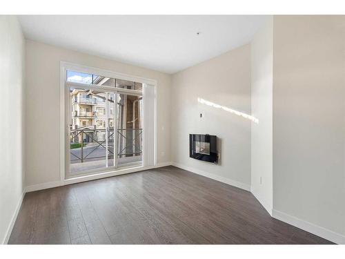 212-28 Auburn Bay Link Se, Calgary, AB - Indoor With Fireplace