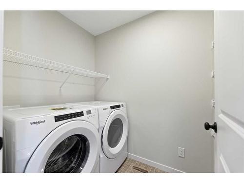 119 Dawson Wharf Rise, Chestermere, AB - Indoor Photo Showing Laundry Room