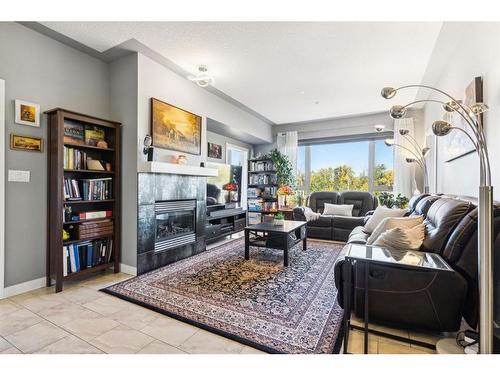 303-35 Inglewood Park Se, Calgary, AB - Indoor Photo Showing Living Room With Fireplace