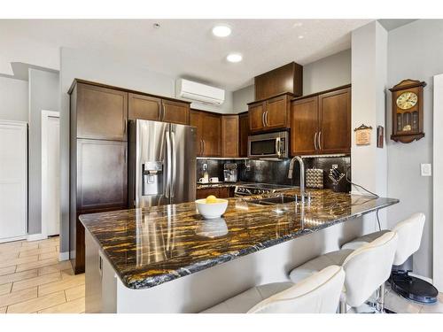 303-35 Inglewood Park Se, Calgary, AB - Indoor Photo Showing Kitchen With Stainless Steel Kitchen With Double Sink