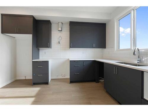 459 Tekarra Drive Nw, Calgary, AB - Indoor Photo Showing Kitchen With Double Sink