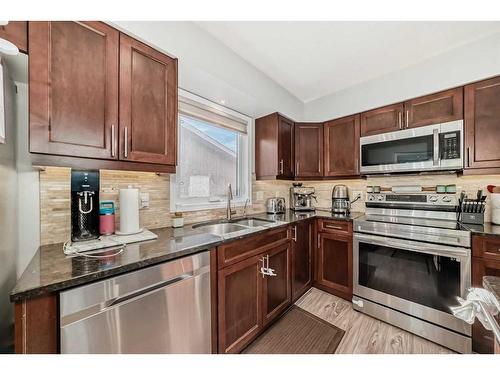 14112 Deer Ridge Drive Se, Calgary, AB - Indoor Photo Showing Kitchen With Double Sink