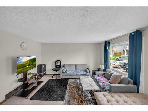 168 Castlegreen Close Ne, Calgary, AB - Indoor Photo Showing Living Room