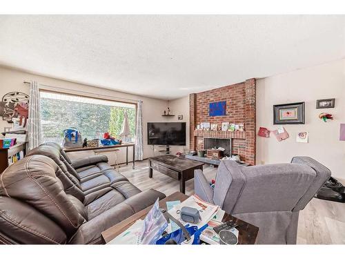 5044 Dalhart Road Nw, Calgary, AB - Indoor Photo Showing Living Room With Fireplace