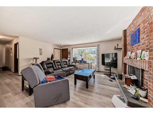 5044 Dalhart Road Nw, Calgary, AB - Indoor Photo Showing Living Room With Fireplace