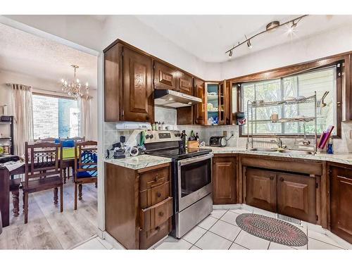 5044 Dalhart Road Nw, Calgary, AB - Indoor Photo Showing Kitchen With Double Sink