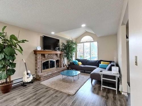 217 Sirocco Place Sw, Calgary, AB - Indoor Photo Showing Living Room With Fireplace