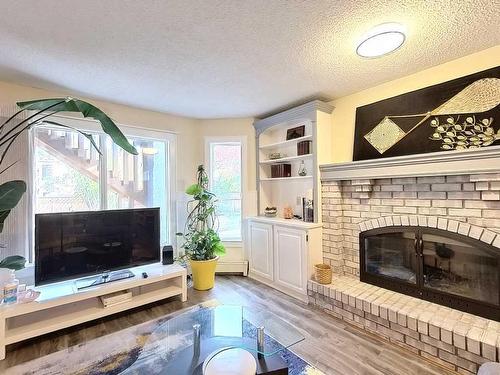 217 Sirocco Place Sw, Calgary, AB - Indoor Photo Showing Living Room With Fireplace