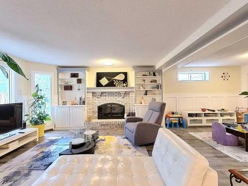 217 Sirocco Place Sw, Calgary, AB - Indoor Photo Showing Living Room With Fireplace