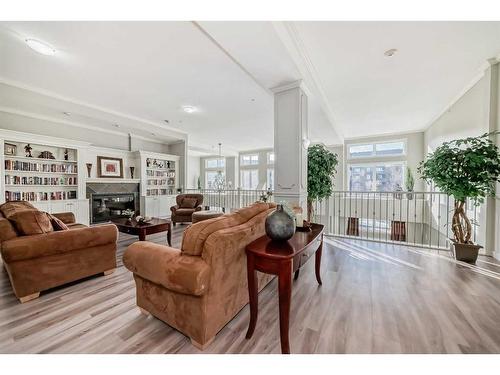 108-15 Everstone Drive Sw, Calgary, AB - Indoor Photo Showing Living Room With Fireplace