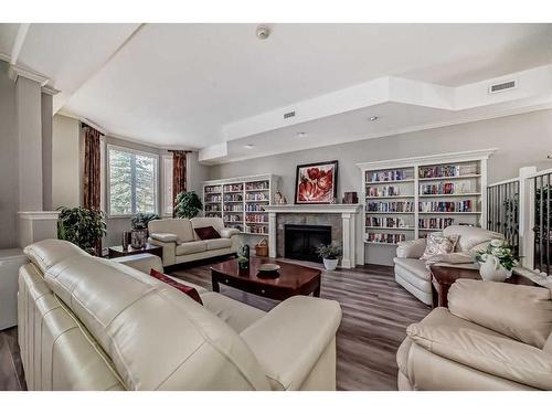 108-15 Everstone Drive Sw, Calgary, AB - Indoor Photo Showing Living Room With Fireplace