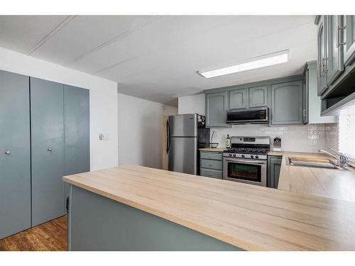 17 Spring Haven Close Se, Airdrie, AB - Indoor Photo Showing Kitchen With Stainless Steel Kitchen