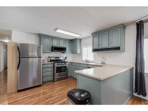 17 Spring Haven Close Se, Airdrie, AB - Indoor Photo Showing Kitchen With Stainless Steel Kitchen With Upgraded Kitchen