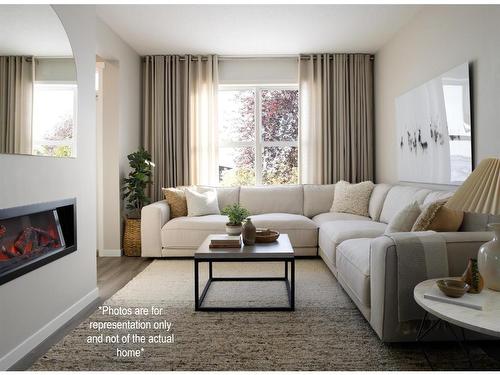 167 Sawgrass Gate Nw, Airdrie, AB - Indoor Photo Showing Living Room With Fireplace