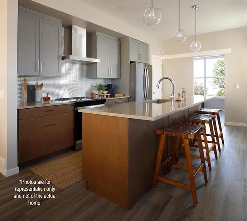 167 Sawgrass Gate Nw, Airdrie, AB - Indoor Photo Showing Kitchen With Upgraded Kitchen