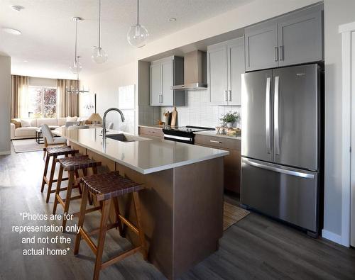 167 Sawgrass Gate Nw, Airdrie, AB - Indoor Photo Showing Kitchen With Upgraded Kitchen