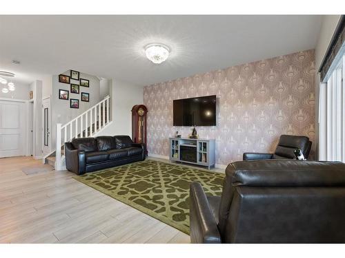 32 Cornerbrook Common Ne, Calgary, AB - Indoor Photo Showing Living Room With Fireplace