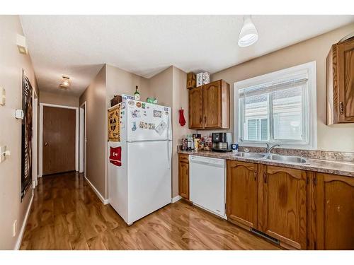 148 Hunterhorn Drive Ne, Calgary, AB - Indoor Photo Showing Kitchen With Double Sink