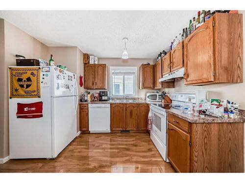 148 Hunterhorn Drive Ne, Calgary, AB - Indoor Photo Showing Kitchen With Double Sink