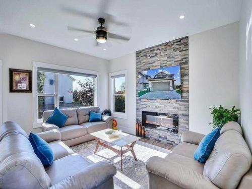 145 Coral Springs Close Ne, Calgary, AB - Indoor Photo Showing Living Room With Fireplace