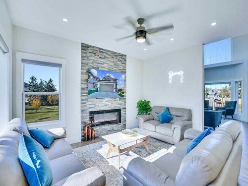 145 Coral Springs Close Ne, Calgary, AB - Indoor Photo Showing Living Room With Fireplace