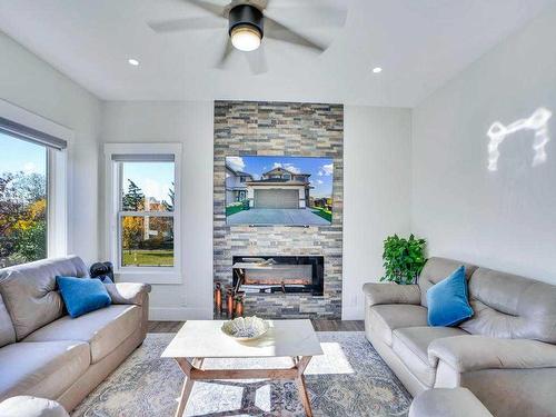 145 Coral Springs Close Ne, Calgary, AB - Indoor Photo Showing Living Room With Fireplace