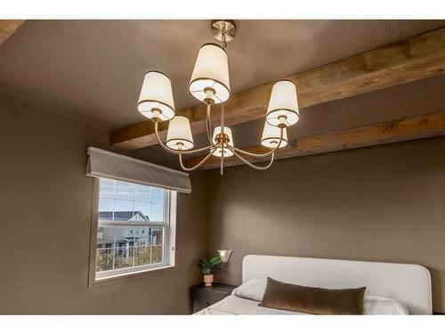 7 Reunion Grove Nw, Airdrie, AB - Indoor Photo Showing Bedroom