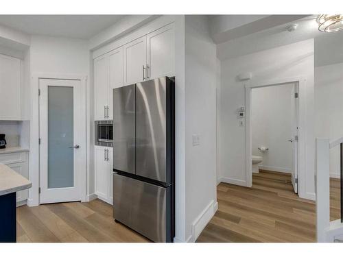 312 Heartland Way, Cochrane, AB - Indoor Photo Showing Kitchen