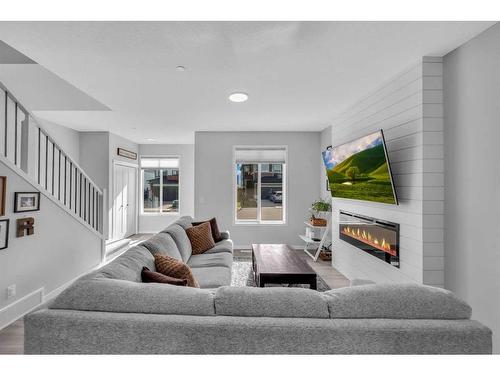 139 Howse Crescent Ne, Calgary, AB - Indoor Photo Showing Living Room With Fireplace