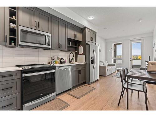 308-3932 University Avenue Nw, Calgary, AB - Indoor Photo Showing Kitchen With Stainless Steel Kitchen With Upgraded Kitchen