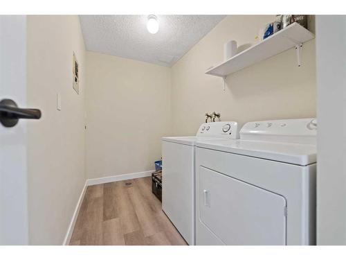 1003-2200 Woodview Drive Sw, Calgary, AB - Indoor Photo Showing Laundry Room