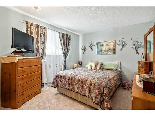 100 Castlegrove Road Ne, Calgary, AB - Indoor Photo Showing Bedroom