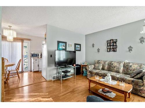 100 Castlegrove Road Ne, Calgary, AB - Indoor Photo Showing Living Room