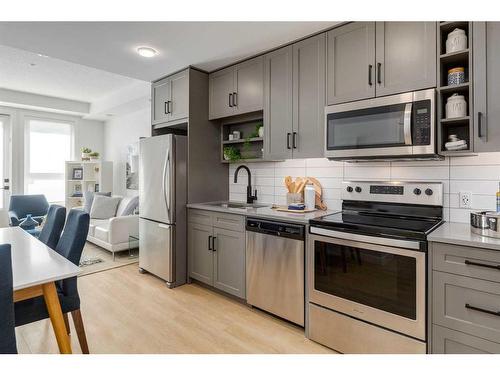 1107-350 Livingston Common Ne, Calgary, AB - Indoor Photo Showing Kitchen With Upgraded Kitchen